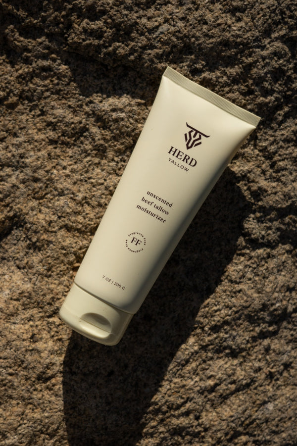 Tube of HERB Skincare product on a textured brown surface